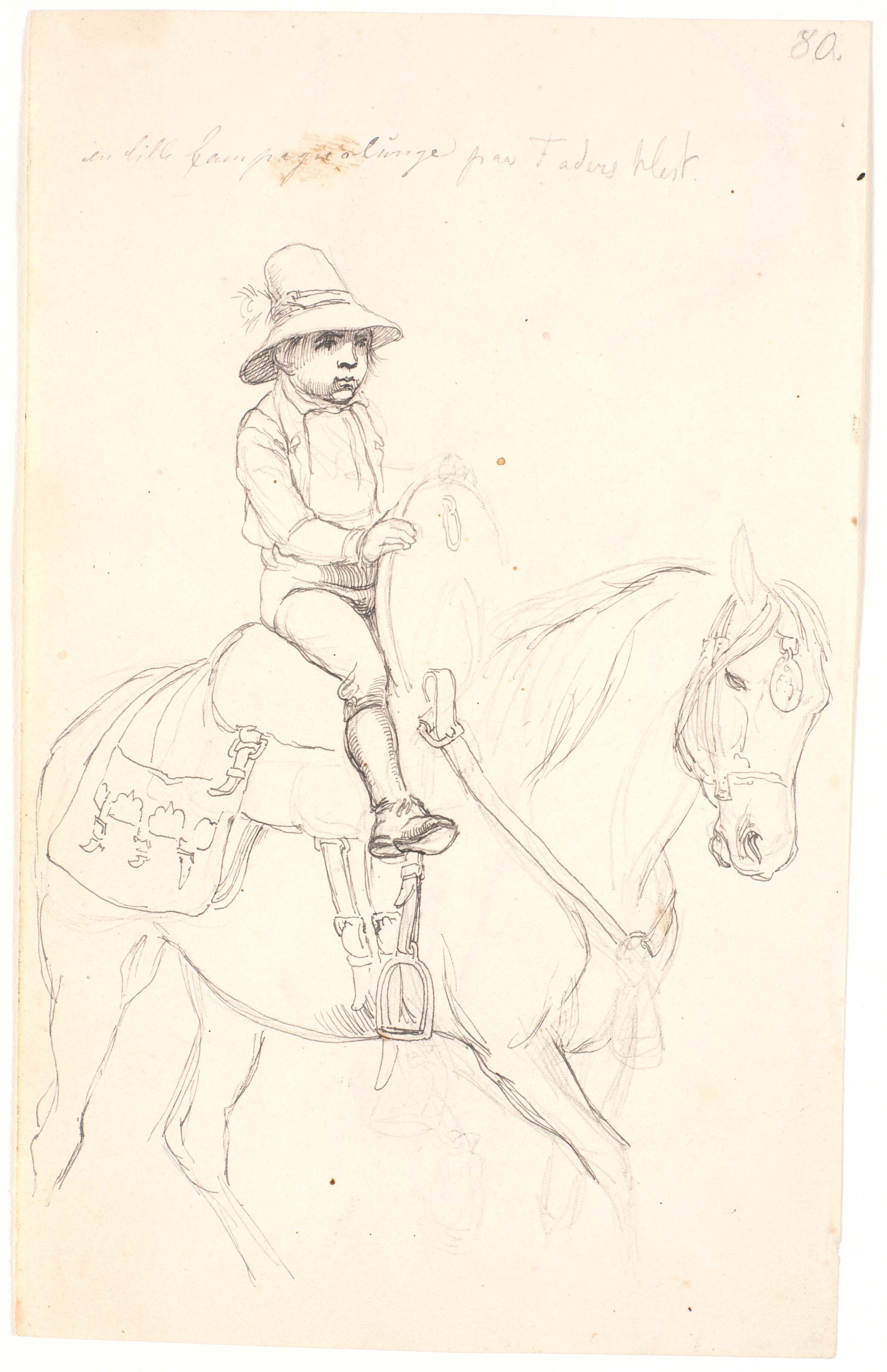 Lille dreng ridende på en hest