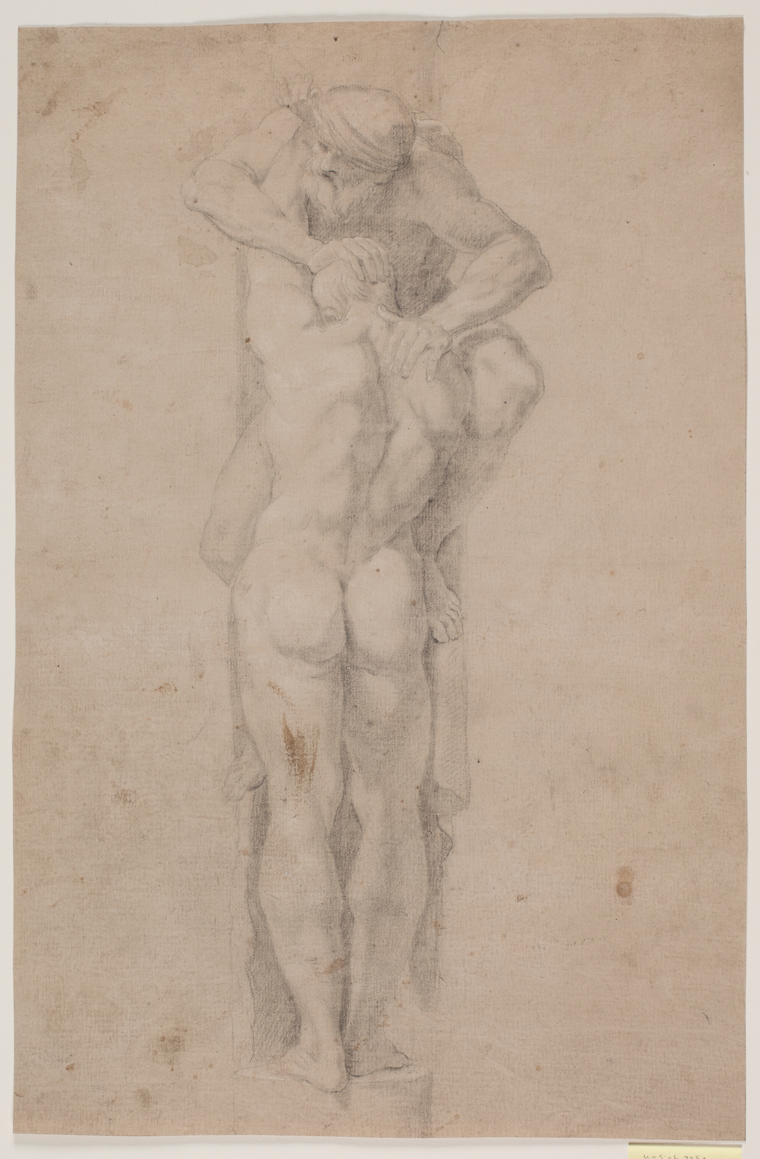 Stående mandlig figur, der holder omkring (eller trykkes ned) af skægget mand