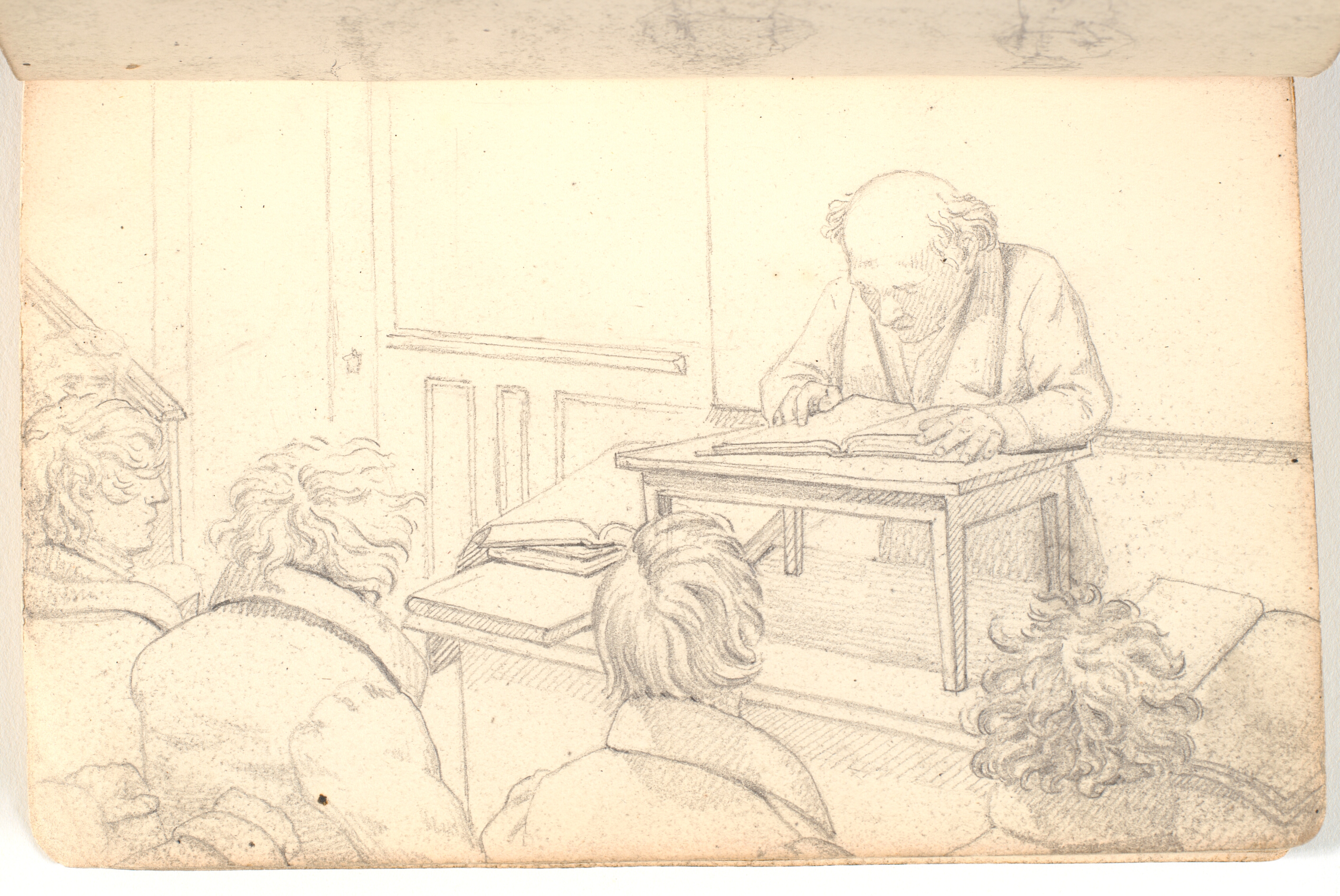 Interiør fra akademiet med oplæser og tilhørere