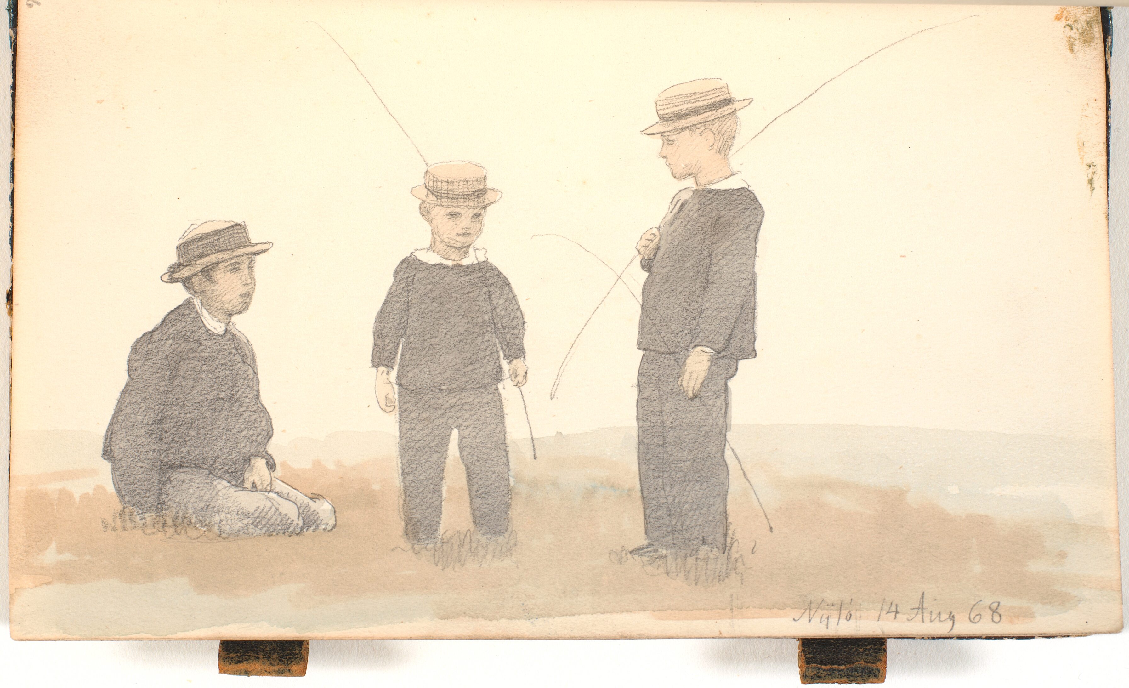 Tre drenge med stråhatte