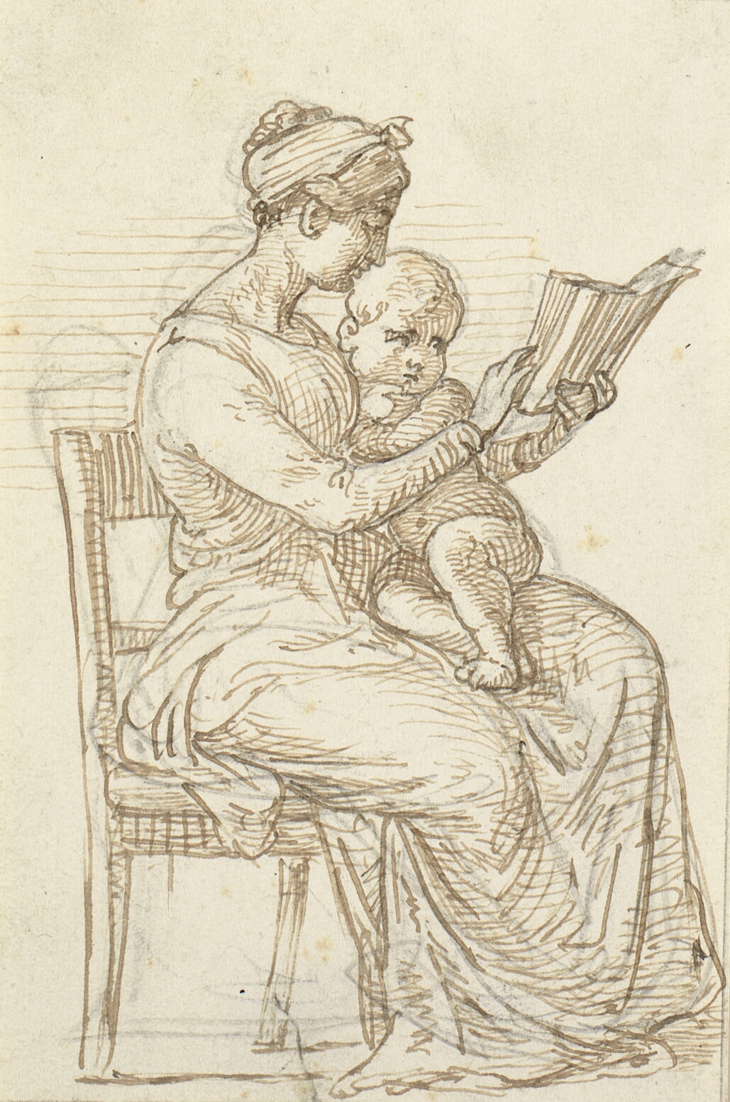 Siddende kvinde viser et lille barn en bog