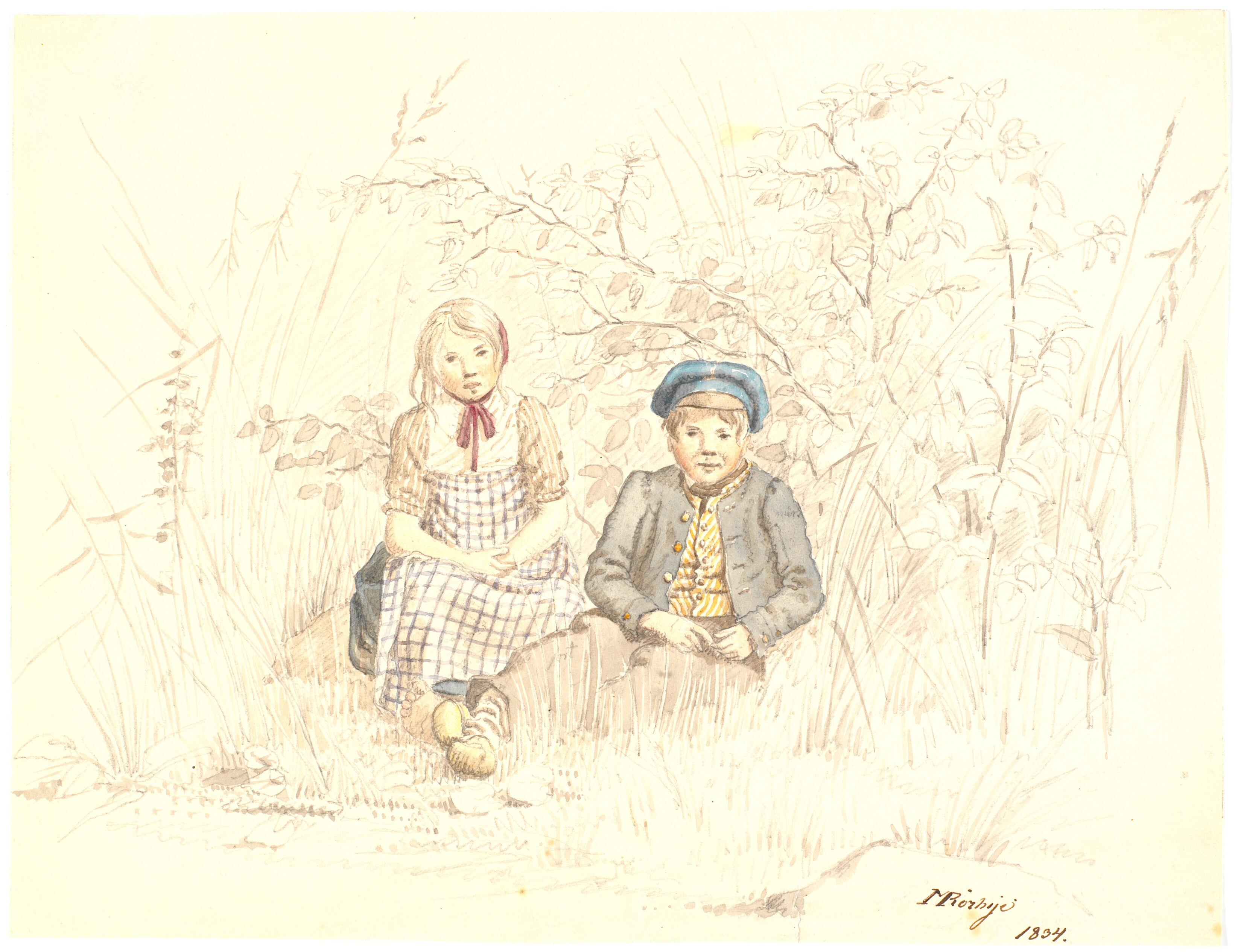 Dreng og pige siddende i det grønne