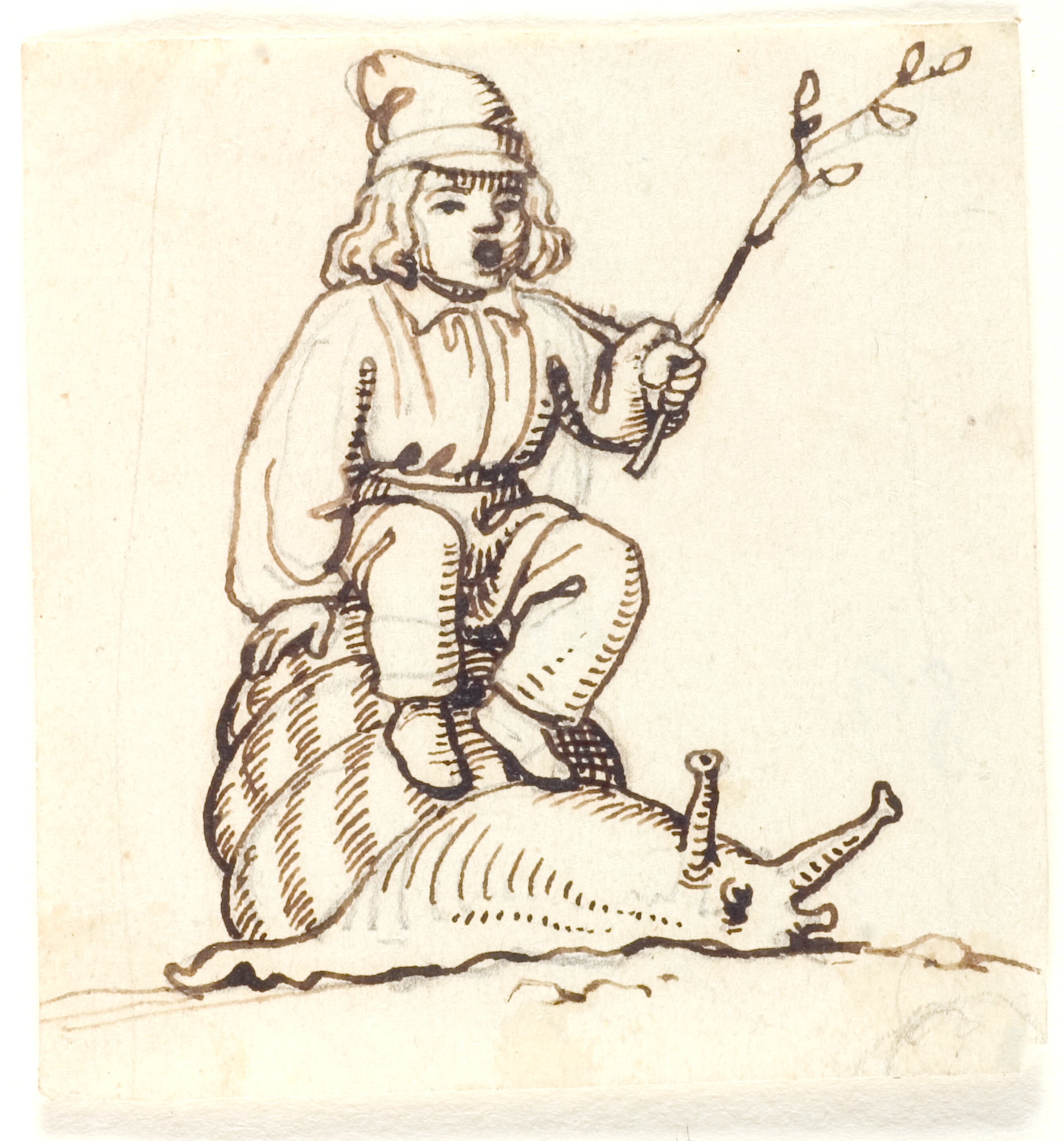 Dreng sidder oven på en snegl