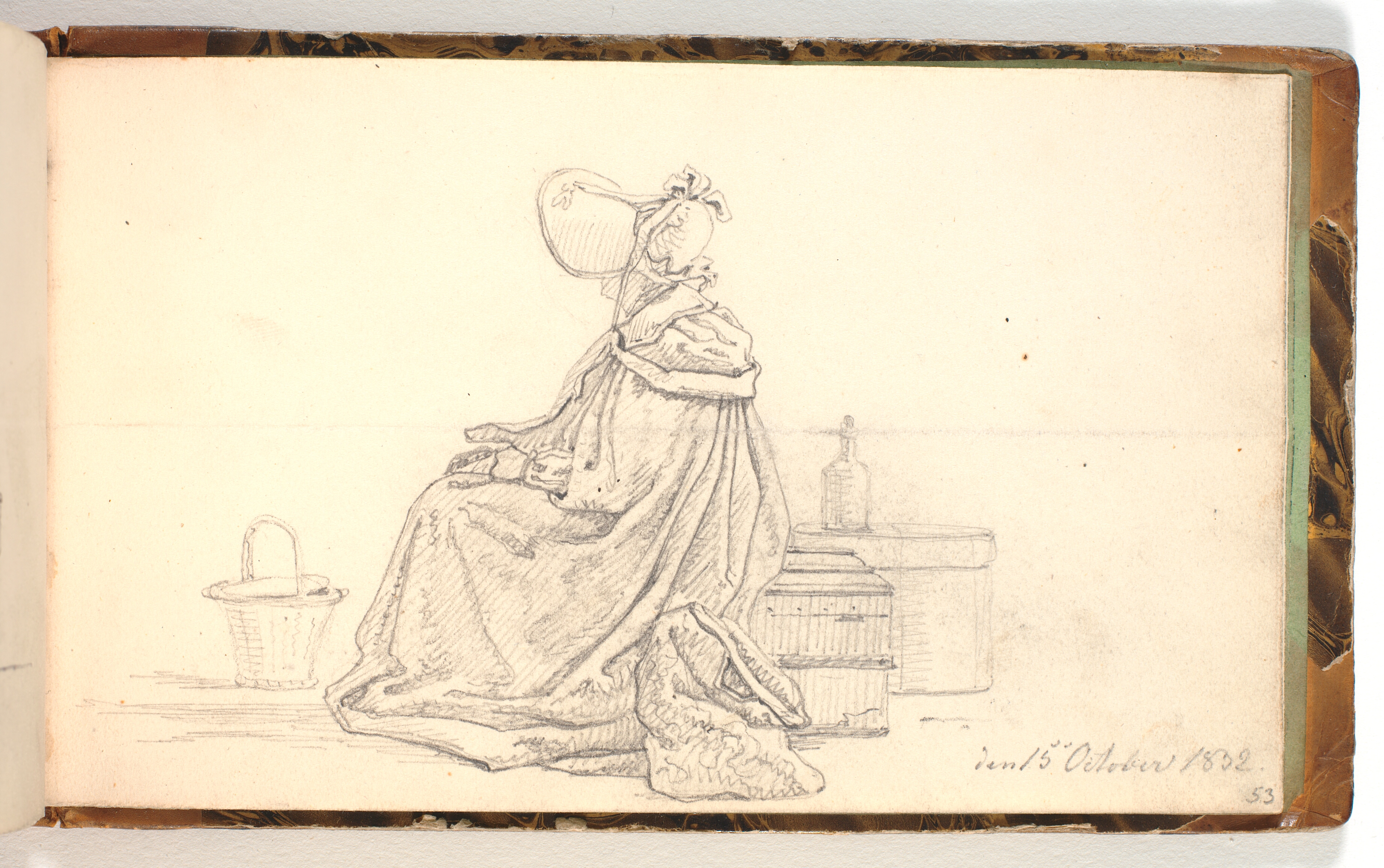 Siddende dame, omgivet af rejsebagage