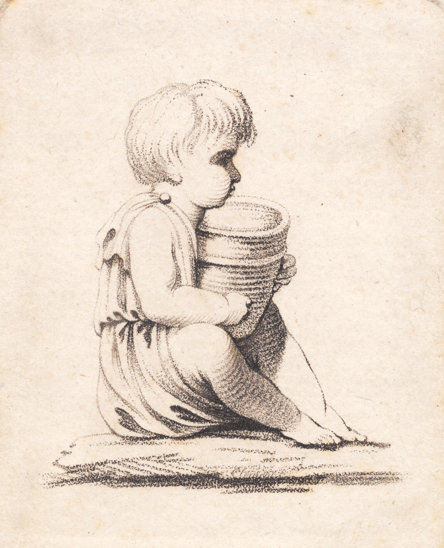 En lille siddende dreng