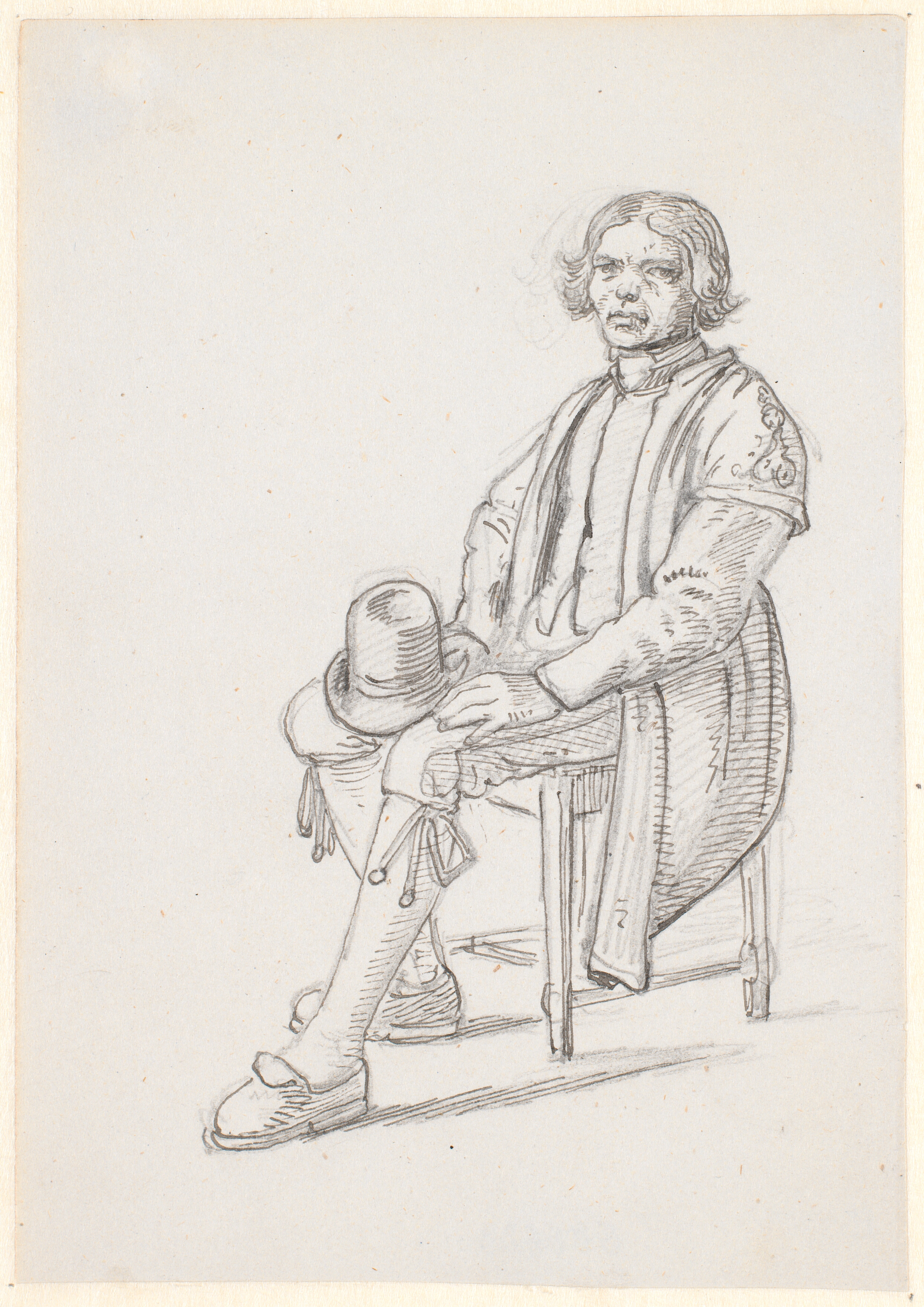 Siddende dalkarl med hatten på knæene