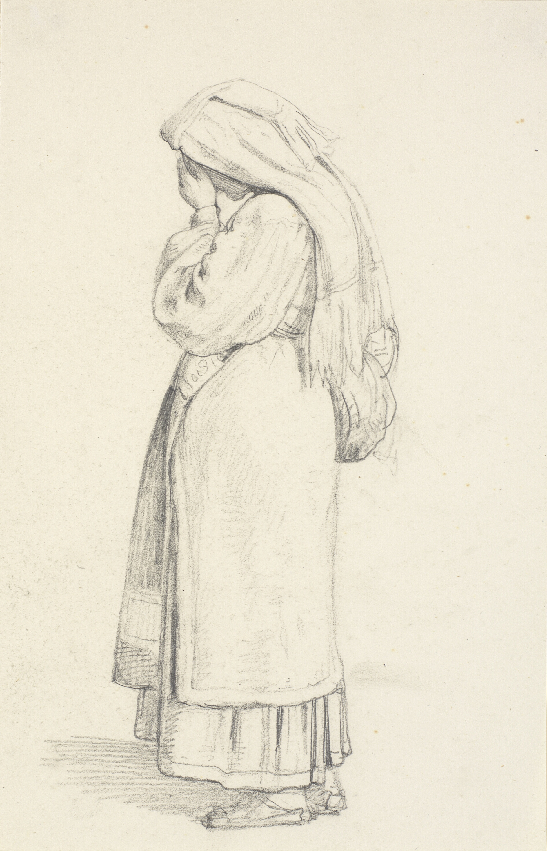 Stående kvinde med hånd for ansigt