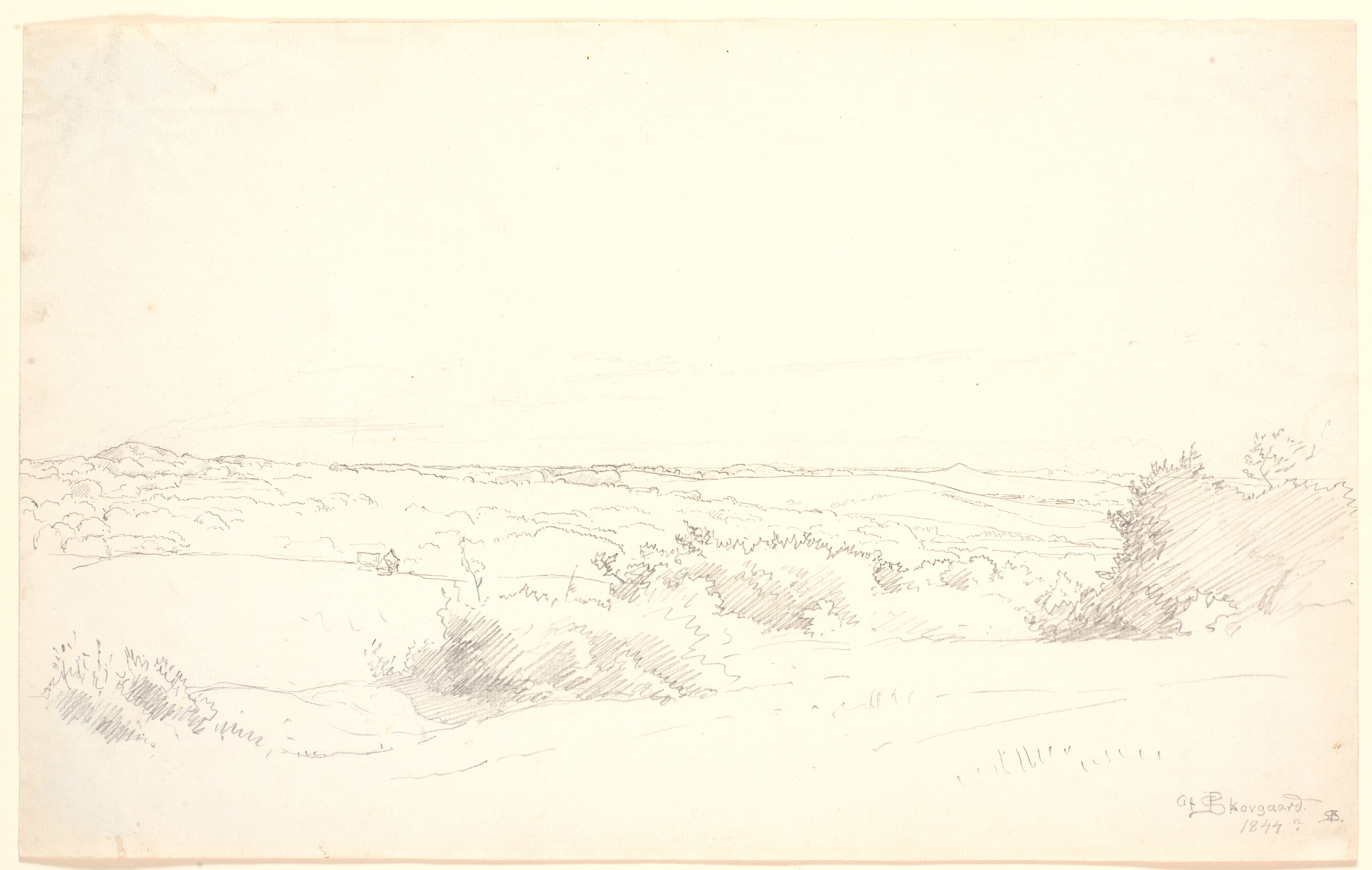 Udsigt over et bakket landskab.