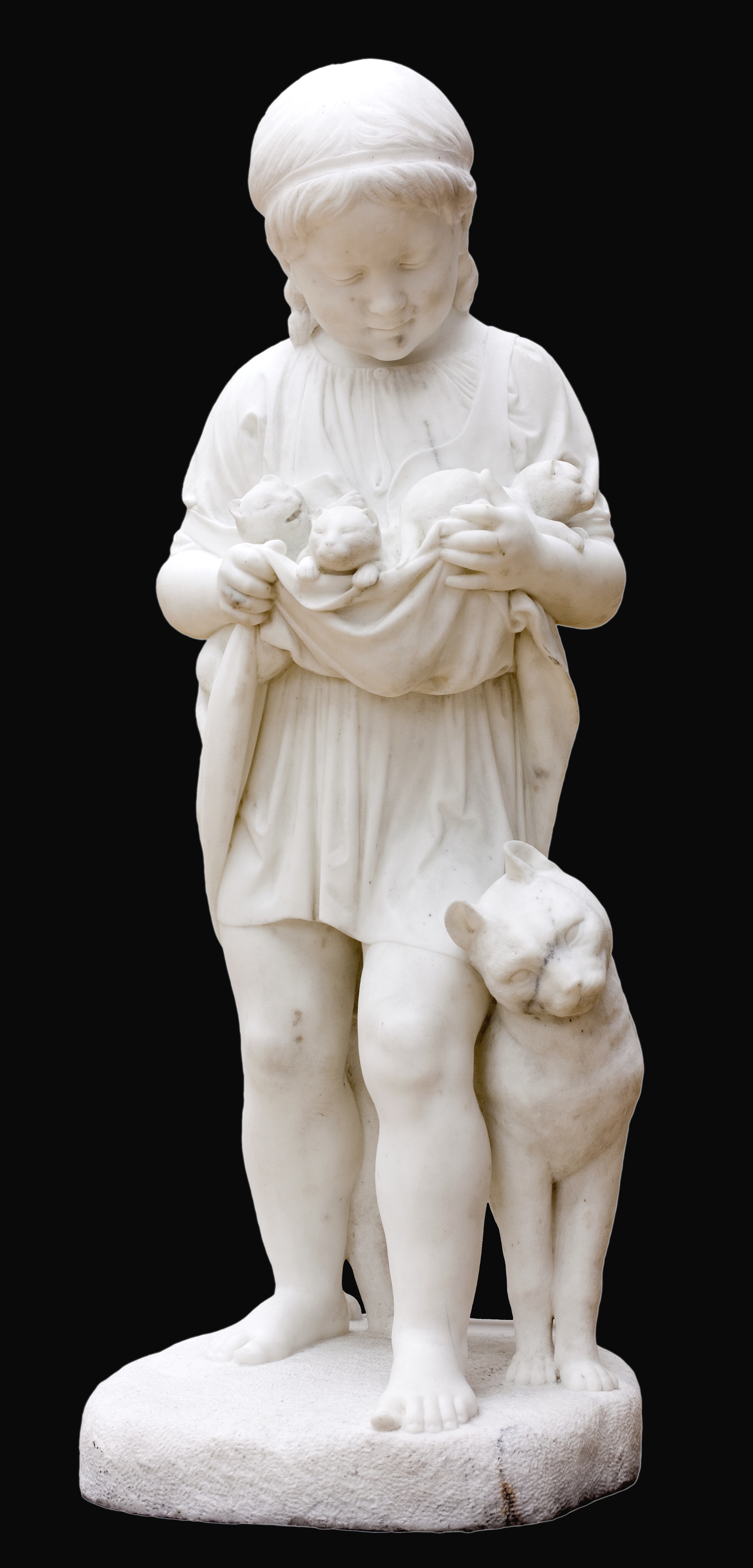 En lille pige med kattekillinger.