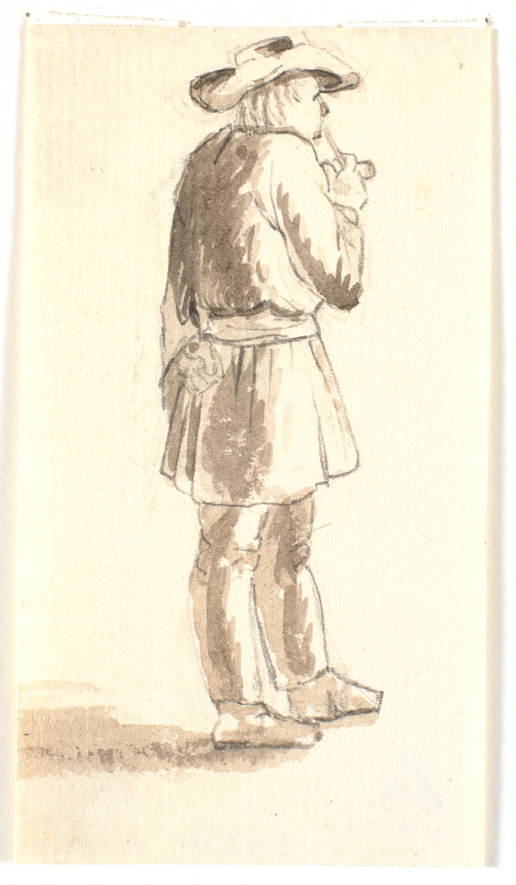 Stående piberygende mand