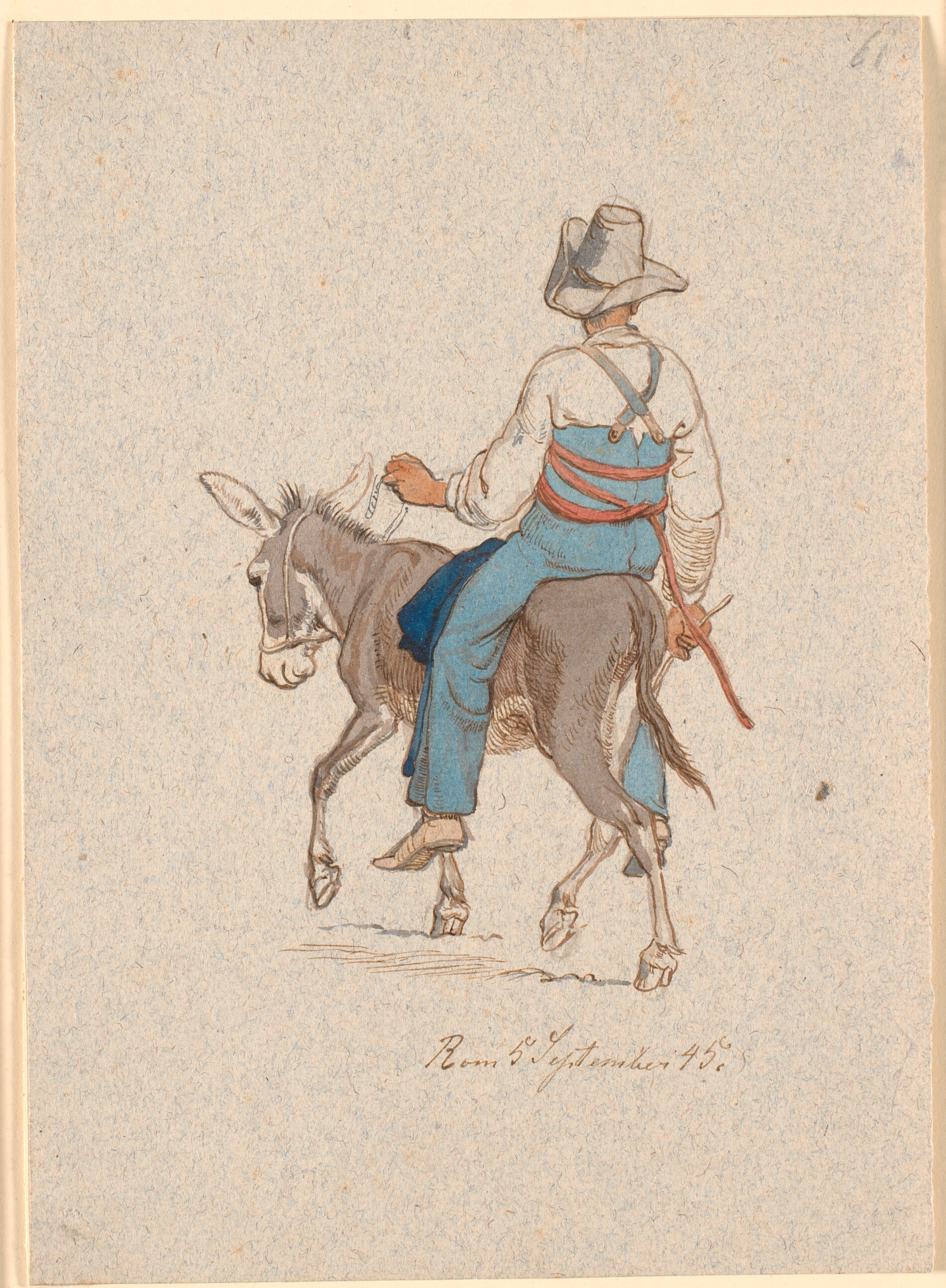 Æselrytter set skråt bagfra