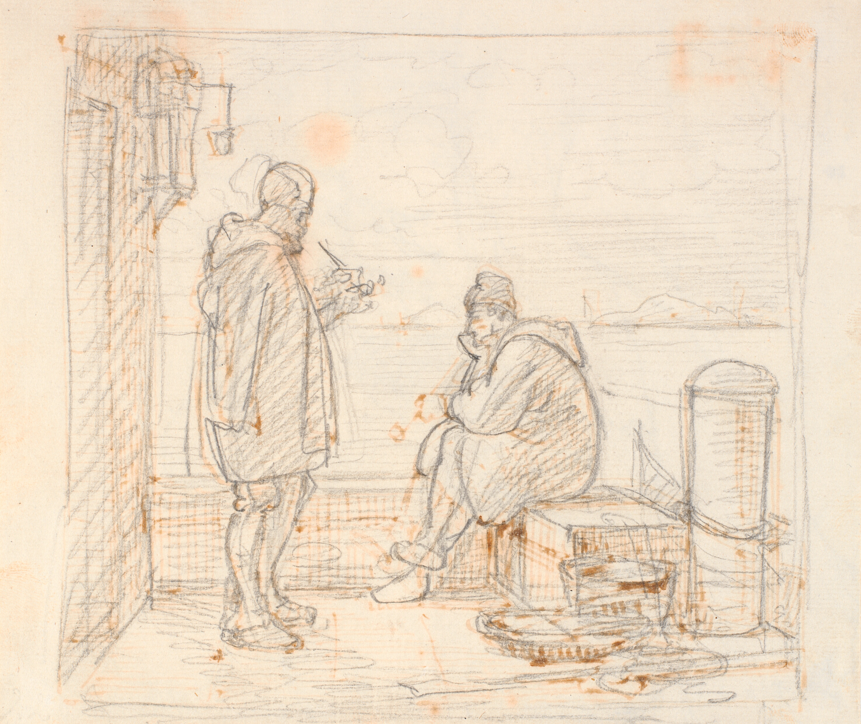 To italienere på en mole ved havet