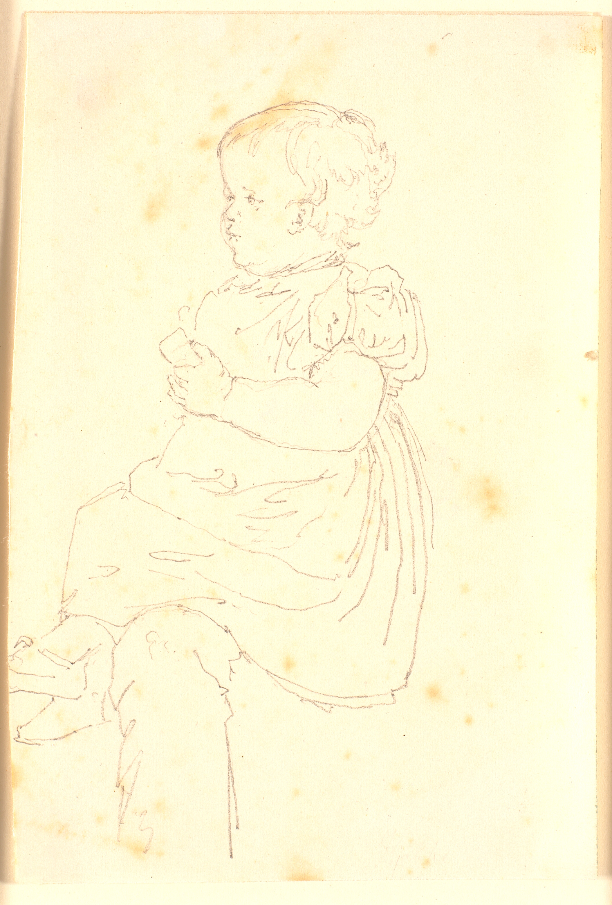 En lille pige siddende på en voksens knæ