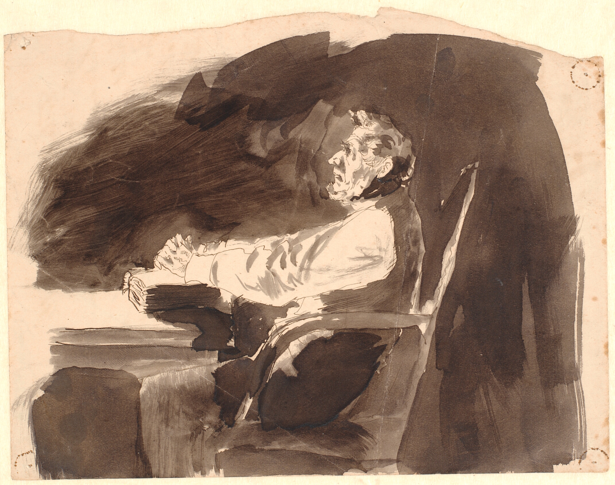 Gammel mand ved et bord med en bibel