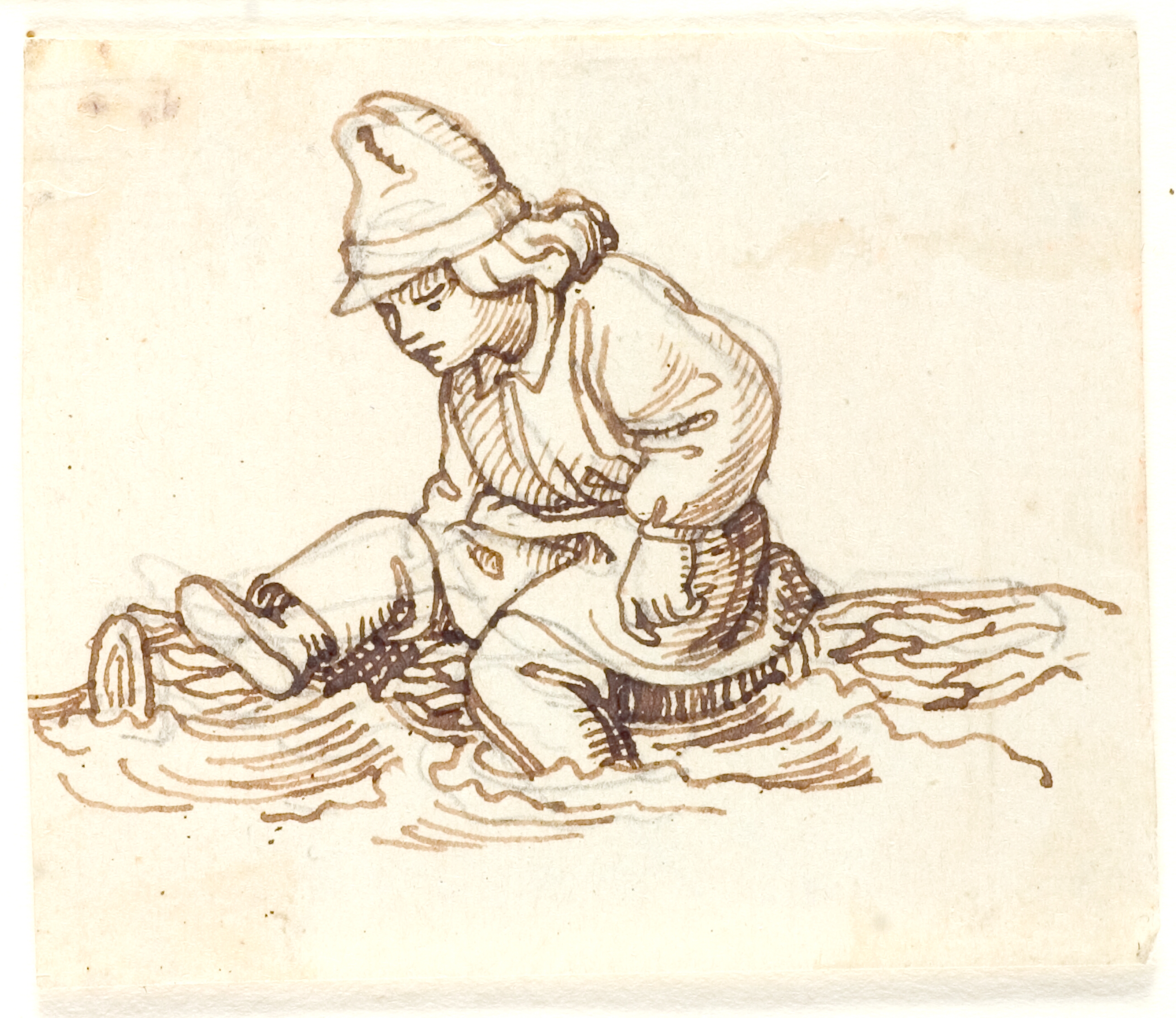 Dreng, der sidder på en træstamme i vandet