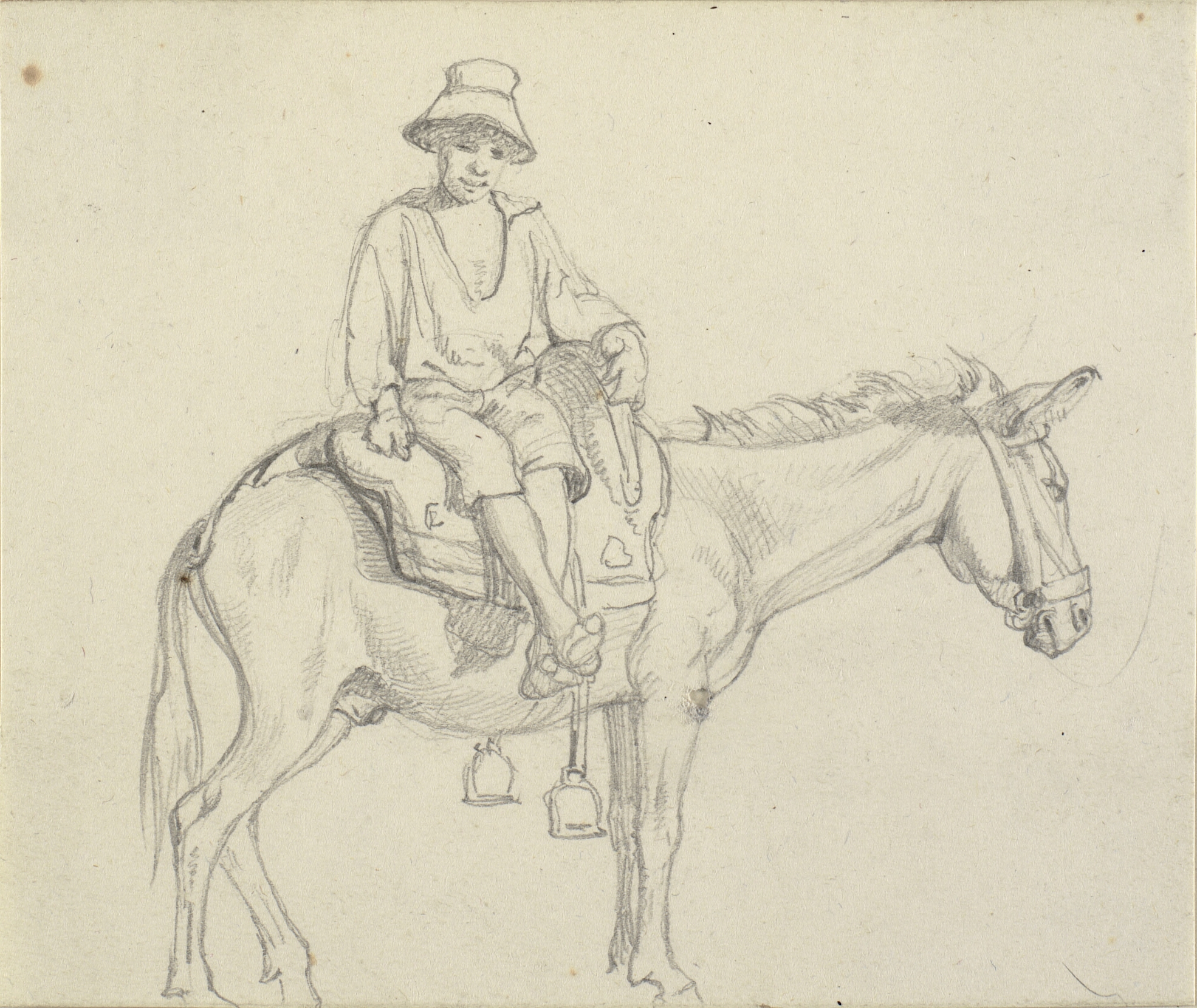 Dreng siddende sidelæns på æsel