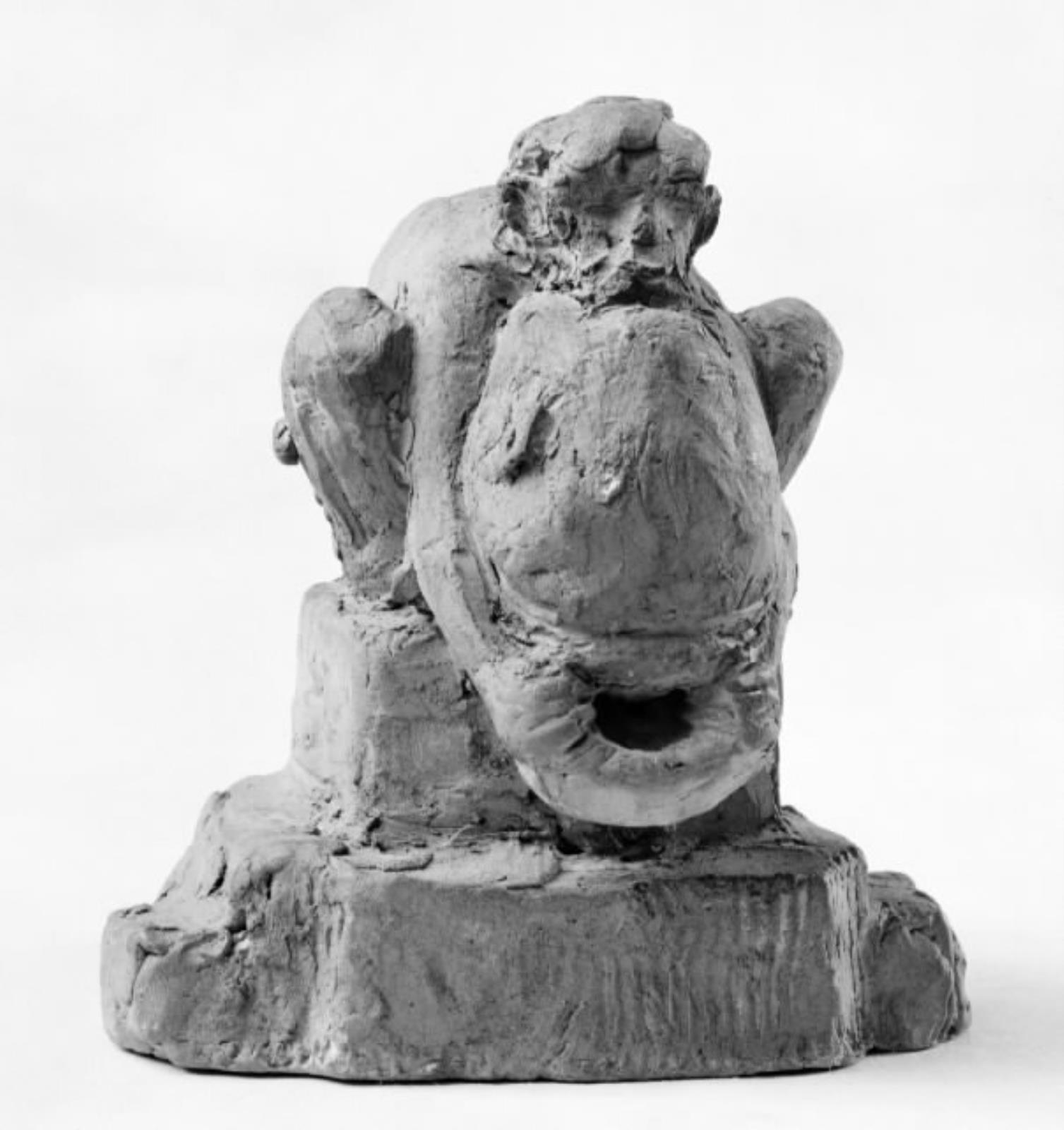 Sammenkrøbet mand med vædderhorn og vandsæk