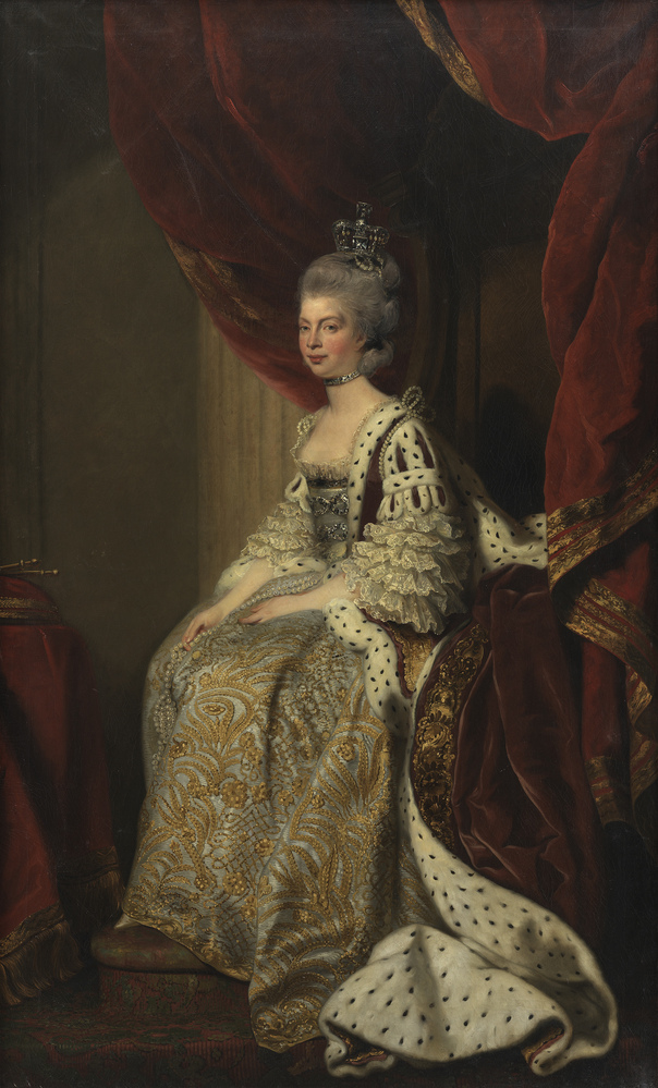 Lille siddende, nøgen dreng