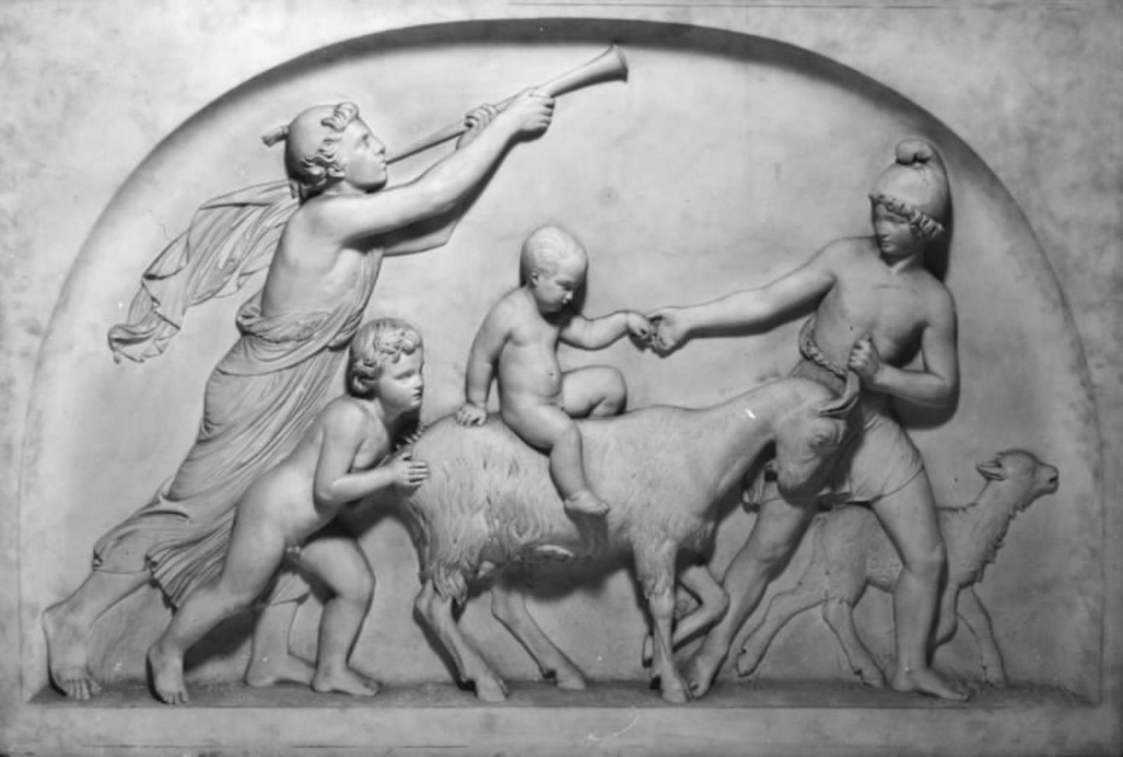 Drenge, der leger med en ged