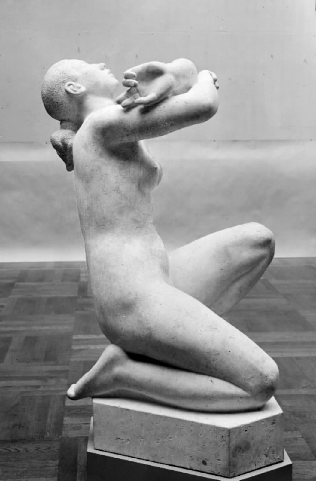 Længsel. Knælende nøgen kvinde