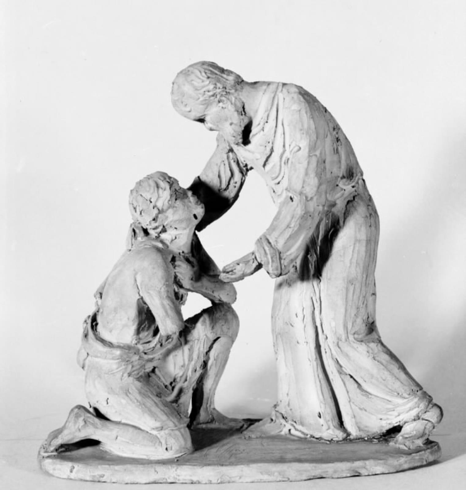 Den fortabte søns hjemkomst. Den stående fader bøjer sig frem mod den knælende søn