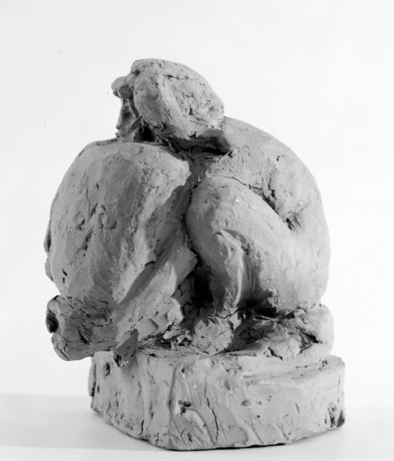 Sammenkrøbet mand med vædderhorn og vandsæk