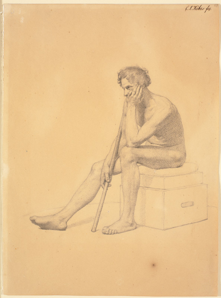 Siddende mandlig akademimodel